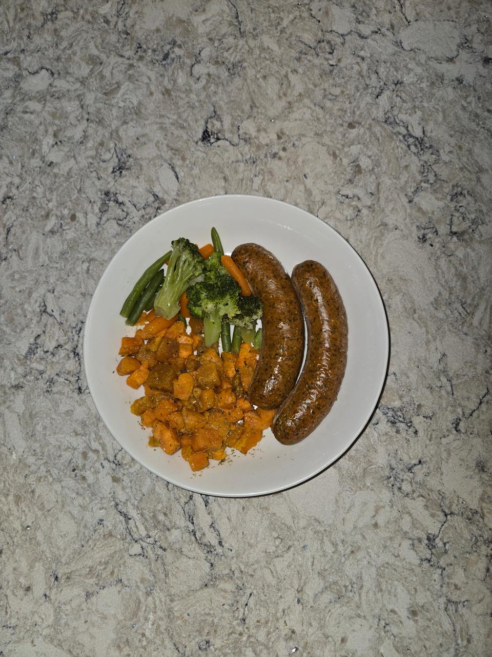 Jerk chicken sausages with sweet potatoes